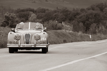 CAGLI, ITALY - OCT 24 - 2020: JAGUAR XK 140 OTS SE 1954 on an old racing car in rally Mille Miglia 2020 the famous italian historical race (1927-1957のeditorial素材