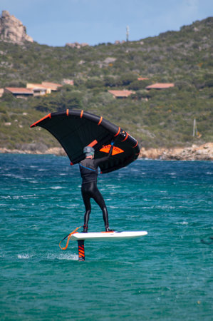 PORTO POLLO - ITALY - APRIL 24, 2020: Wing Foil activities on the SEA FROT MADDALENA ISLAND PORTO...