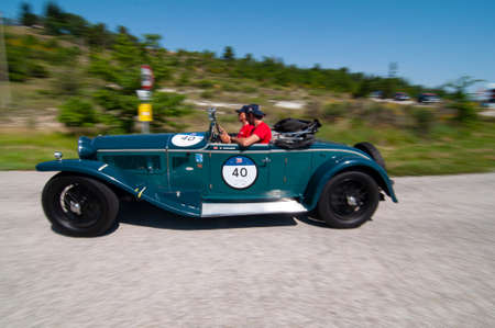 URBINO, ITALY - JUN 16 - 2022: LANCIA LAMBDA SPIDER TIPO 221 CASARO 1929 on an old racing car in rally Mille Miglia 2022 the famous italian historical race (1927-1957 on an old racing car in rally Mille Miglia 2022 the famous italian historical race (1927のeditorial素材