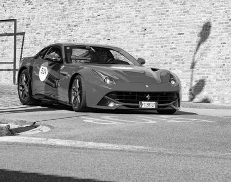 URBINO, ITALY - JUN 16 - 2022: FERRARI TRIBUTE Ferrari F12 Berlinetta IN an old racing car in rally Mille Miglia 2022のeditorial素材