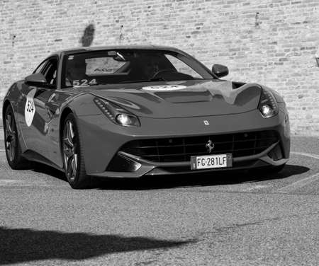 URBINO, ITALY - JUN 16 - 2022: FERRARI TRIBUTE Ferrari F12 Berlinetta IN an old racing car in rally Mille Miglia 2022のeditorial素材