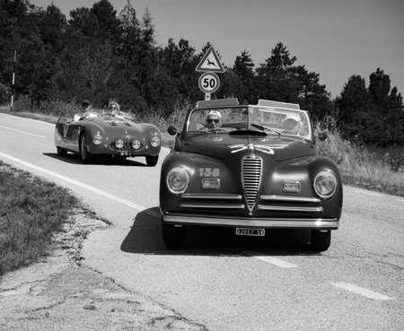 URBINO, ITALY - JUN 16 - 2022: ALFA ROMEO 6C 2500 S CABRIOLET PININ FARINA 1947 on an old racing car in rally Mille Miglia 2022 the famous italian historical race (1927-1957のeditorial素材