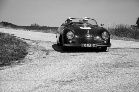 URBINO - ITALY - JUN 16 - 2022: PORSCHE 356 1500 SPEEDSTER 1955 on an old racing car in rally Mille Miglia 2022 the famous italian historical race (1927-1957のeditorial素材