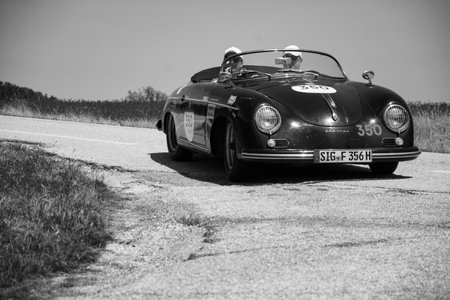 URBINO - ITALY - JUN 16 - 2022: PORSCHE 356 1500 SPEEDSTER 1955 on an old racing car in rally Mille Miglia 2022 the famous italian historical race (1927-1957のeditorial素材