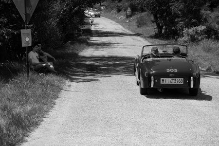 URBINO - ITALY - JUN 16 - 2022: TRIUMPH TR2 SPORTS 1954 on an old racing car in rally Mille Miglia 2022 the famous italian historical race (1927-1957のeditorial素材