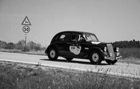URBINO - ITALY - JUN 16 - 2022: LANCIA ARDESIA 1952 on an old racing car in rally Mille Miglia 2022 the famous italian historical race (1927-1957のeditorial素材