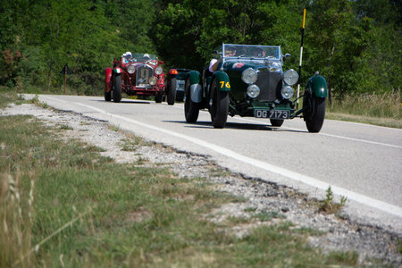 URBINO - ITALY - JUN 16 - 2022: ASTON MARTIN LE MANS 1933 on an old racing car in rally Mille Miglia 2022 the famous italian historical race (1927-1957のeditorial素材