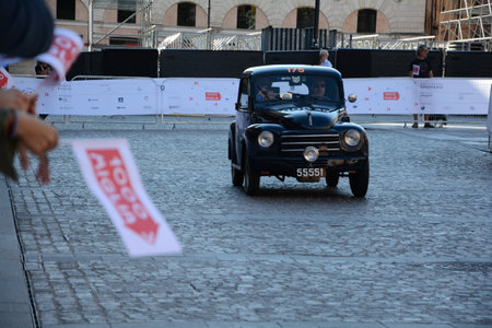 FERRARA , ITALY - jun 15 -2024 : A classic car races through the streets of Ferrara during the 2024 Mille Miglia.のeditorial素材
