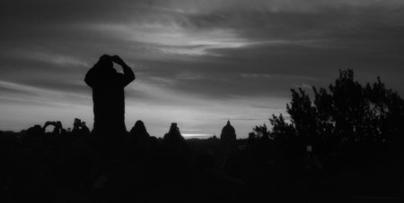 ROME, ITALY - DEC 7 -2025 : A breathtaking panoramic view of the Roman sunset, captured from the crowded Pincio Terrace.の写真素材