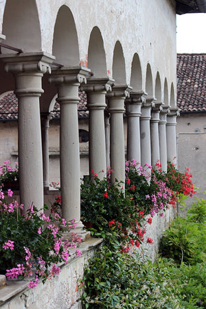 Colonnade in the cloister of an ancient abbey in Italyの写真素材