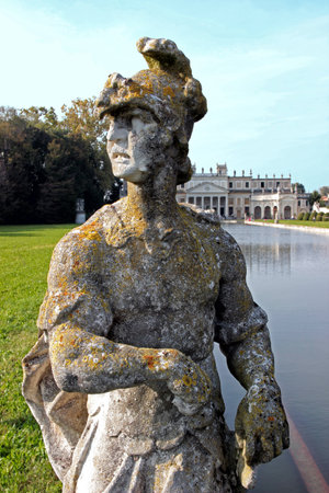 Statue by the pool in the huge park of Villa Pisani, Italyの写真素材