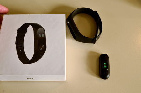 Turin, Piedmont, Italy. November 2018. The Mi band with its packaging and some spare straps in assorted colors. Handling and use.のeditorial素材
