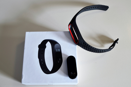 Turin, Piedmont, Italy. November 2018. The Mi band with its packaging and some spare straps in assorted colors. Handling and use.のeditorial素材