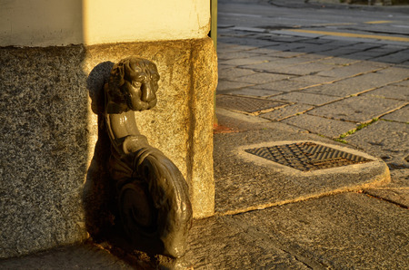 Turin, Piemote, Italy. July 2018. Vintage urban furnishing details: the pararuota or the kerbstones in the gates of the old houses in the center are small works of art.のeditorial素材