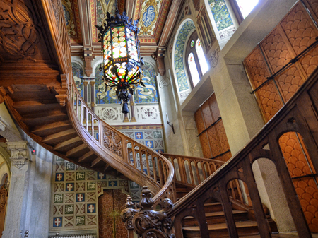 Gressoney-Saint-Jean, Valle d'Aosta region, Italy. 25 April 2018. Castel Savoia, is a villa built in the late 1800s in eclectic style. Inside, the fabulous wooden staircase.のeditorial素材
