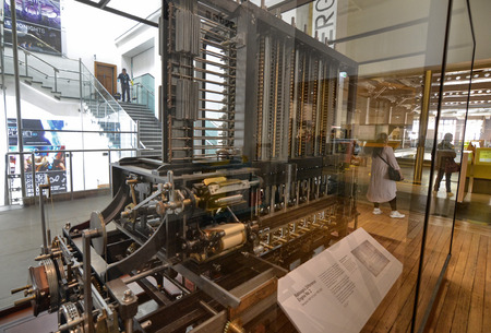 London, United Kingdom, June 2018. Babbage's machine is the progenitor of modern computers. It is a mechanical analogic computer, conserved at the London Science Museum.のeditorial素材