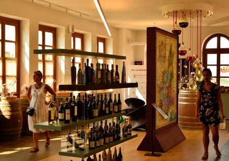 Barolo, Piedmont, Italy. July 2018. At the shop and wine tasting at the foot of the castle. The vending machines allow to fill the glass with the chosen wine.のeditorial素材