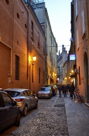 Bologna, Emilia Romagna, Italy. December 2018. Entering the historical center, among the small secondary roads, at dusk there are a thousand yellow lights for the Christmas holidays. Very nice.のeditorial素材