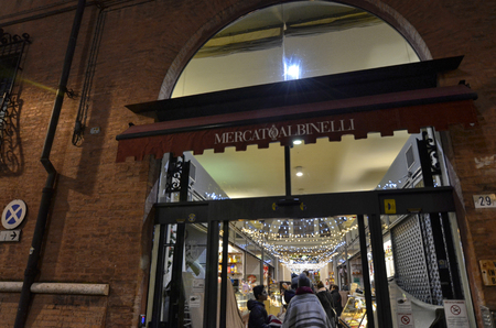 Modena, Emilia Romagna, Italy. December 2018. Night view of the Albinelli market entrance: the historical central market of the city.のeditorial素材
