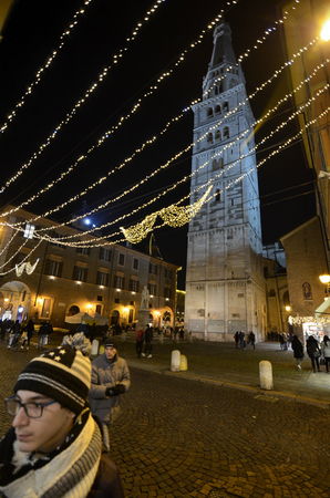 Modena, Emilia Romagna, Italy. December 2018. Night view of the Ghirlandina. Is the bell tower of the city: entering the historical center you immediately notice it. High 86 meters is slightly leaning.のeditorial素材