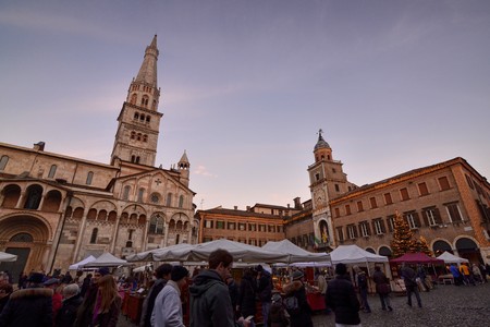Modena, Emilia Romagna, Italy. December 2018. Piazza Maggiore is the center of the city. The clock...