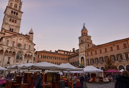 Modena, Emilia Romagna, Italy. December 2018. Piazza Maggiore is the center of the city. The clock tower with the cathedral are characteristic elements of the square. Headquarter of markets and events.のeditorial素材