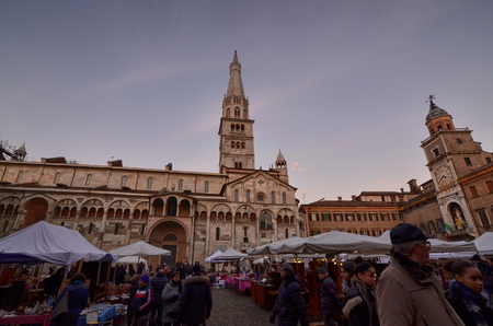 Modena, Emilia Romagna, Italy. December 2018. Piazza Maggiore is the center of the city. The clock tower with the cathedral are characteristic elements of the square. Headquarter of markets and events.のeditorial素材