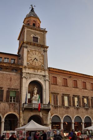 Modena, Emilia Romagna, Italy. December 2018. Piazza Maggiore is the historic center of the city. The clock tower, together with the cathedral is one of the characteristic elements of the square.のeditorial素材