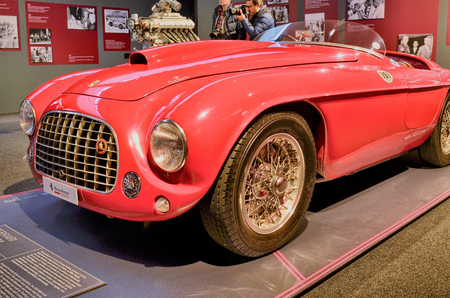 Maranello, Emilia Romagna, Italy. December 2018. At the Ferrari museum the exhibition hall with models of debut. The 250 GT berlinetta and the 166 MM. Enzo Ferrari's memorable statements on the walls.のeditorial素材