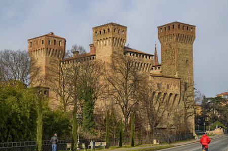 Vignola, Emilia Romagna, Italy. January 2019. The fortress of Vigonola seen from the south, overlooking the bank of the river Panaro. The cars, along the bridge over the river, can admire it.のeditorial素材