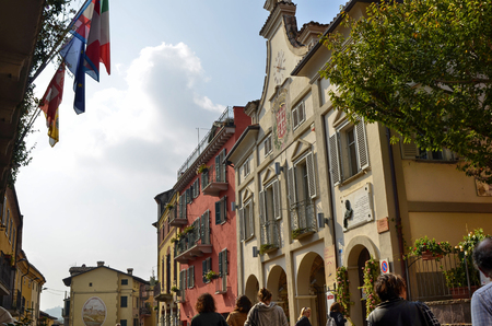 Neive, Piedmont, Italy. October 2018. In the square of the historic center the town hall draws attention with its clock and the banner with the common inscription of Neive.のeditorial素材