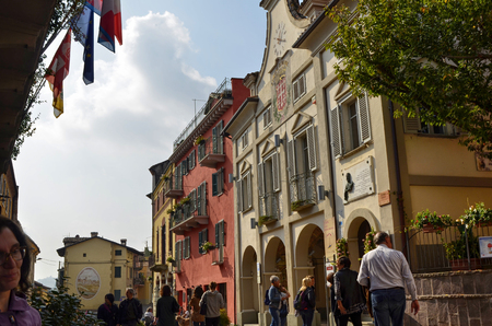 Neive, Piedmont, Italy. October 2018. In the square of the historic center the town hall draws attention with its clock and the banner with the common inscription of Neive.のeditorial素材