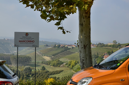 Neive, Piedmont, Italy. October 2018. The landscape of the vineyards of Barbaresco with the sign of the municipality of neive with the additional name marcorino.のeditorial素材