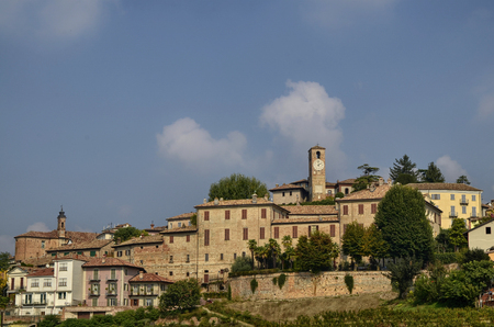 Neive, Italy. October 2018. Going up towards the village the view is enchanting: on the top of the hill the inhabited center, the clock tower stands out, at the foot the magnificent vineyards.のeditorial素材