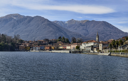 Mergozzo, Piedmont, Italy. March 2019. View of the village overlooking the calm waters of the lake. The facades with their warm and bright colors stand out.のeditorial素材