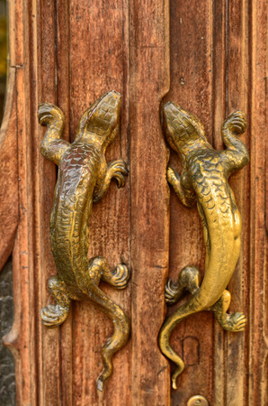 Turin, Piemonte, Italy. October 2018. The house of victory or home of the dragons, is one of the examples of the Neo-Gothic style civil residence of the city. Detail of the door handles.のeditorial素材