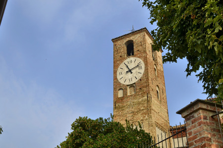 Neive, Piedmont, Italy. October 2018. The clock tower, or civic tower, or municipal tower. It is...
