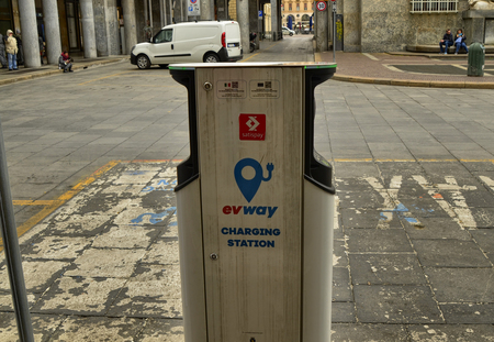 Turin, Piedmont, Italy. April 2018. In the CLN square a charging station for electric cars. In the background the fountain that embodies the river Poのeditorial素材