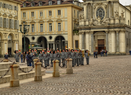 Turin, Piemonte, Italy. April 2019. In Piazza San Carlo an exhibition by the military corps of the Bersaglieri. The team of trumpeters keeps the position waiting for orders.のeditorial素材