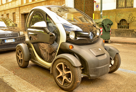 Turin, Piedmont, Italy. May 2019. In the historic center the Renault Twizy: the compactness of this two-seat electric quadricycle facilitates urban mobility. The Z.E. indicates zero emissions. 30Fps.のeditorial素材