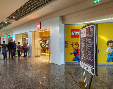 Grugliasco, Piedmont, Italy. May 2019. The Lego store at a shopping mall. On the side of the shop, the logo and the characters drawn on the entire wall. People walk and visit the storeのeditorial素材