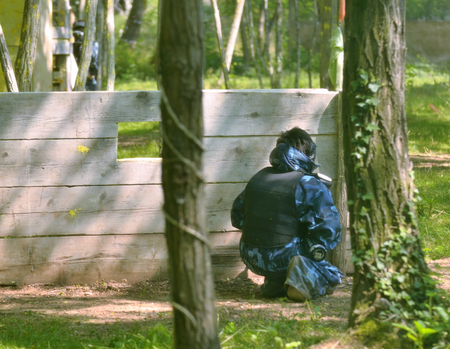 Paintball battle. The battlefield is equipped with barriers: they allow players to shoot their opponents from a privileged point of view while remaining protected.の写真素材