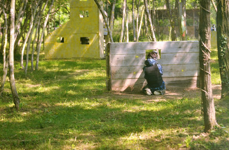 Paintball battle. The battlefield is equipped with barriers: they allow players to shoot their opponents from a privileged point of view while remaining protected.の写真素材