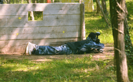 Paintball battle. The battlefield is equipped with barriers: they allow players to shoot their opponents from a privileged point of view while remaining protected.の写真素材