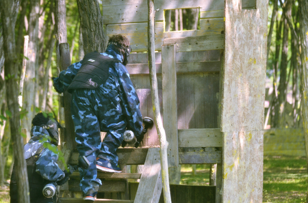 Paintball battle. The battlefield is equipped with turrets: they allow players to shoot their opponents from a privileged point of view while remaining protected.の写真素材