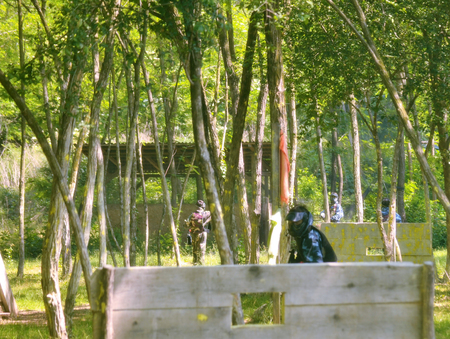 Paintball battle. The battlefield is equipped with barriers: they allow players to shoot their opponents from a privileged point of view while remaining protected.の写真素材