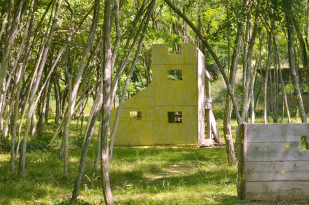 Paintball battle. The battlefield is equipped with barriers: they allow players to shoot their opponents from a privileged point of view while remaining protected.の写真素材