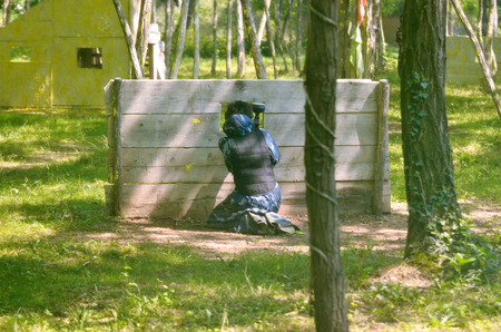 Paintball battle. The battlefield is equipped with barriers: they allow players to shoot their opponents from a privileged point of view while remaining protected.の写真素材