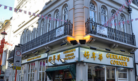 London, United Kingdom, June 2018. The chinatown district: a swarm of Chinese tradition in restaurants with bright colors and a crowd of tourists. A specialty on all the crispy duck.のeditorial素材