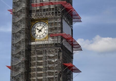 London, United Kingdom, June 2018. Viewpoint from the Westminster Bridge towards the Houses of Parliament and Big Ben. Conservation in perfect condition periodically requires scaffolding.のeditorial素材